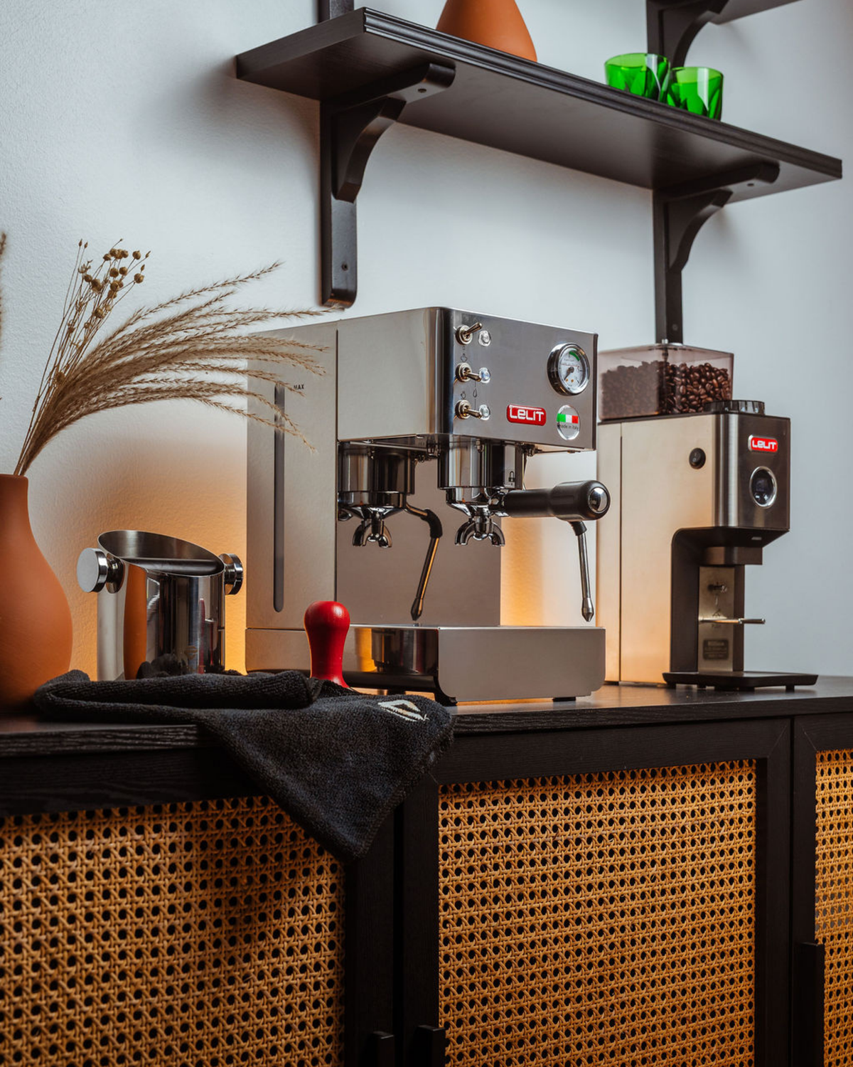 Angled view of LELIT Anna PL41LEM beside a separate coffee grinder